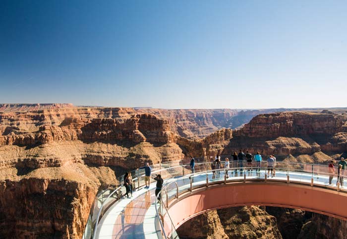 Tourists on Skywalk at Eagle Point, a glass bridge over the west rim of the Grand Canyon.